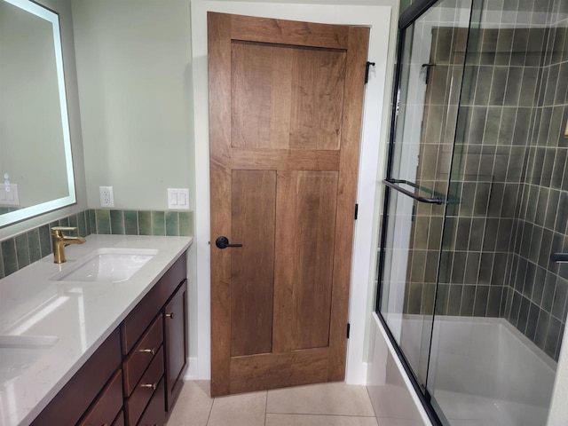 1100 Moll Dr, Waunakee, WI 53597 - full bathroom featuring double vanity, tile patterned flooring, and enclosed tub / shower combo
