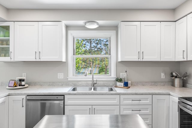 30 Highland Ave, Ripon, WI 54971 - kitchen featuring appliances with stainless steel finishes, a sink, white cabinetry, light countertops, and glass insert cabinets