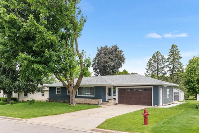 30 Highland Ave, Ripon, WI 54971 - ranch-style home featuring an attached garage, a front lawn, driveway, stone siding, and a shingled roof