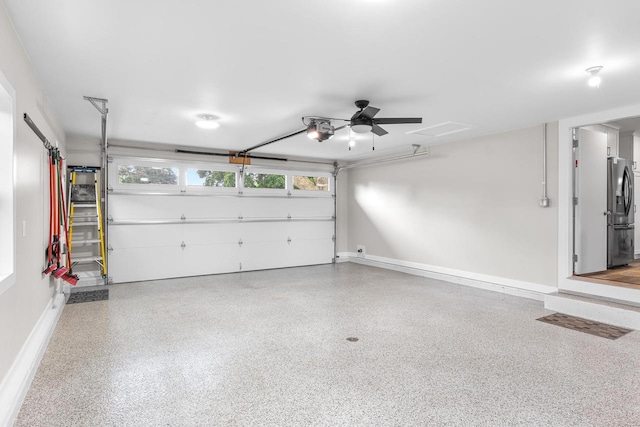 30 Highland Ave, Ripon, WI 54971 - garage with refrigerator with ice dispenser, baseboards, and a garage door opener