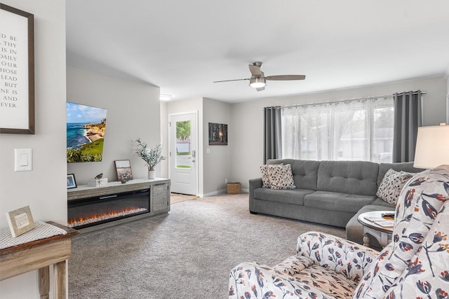 30 Highland Ave, Ripon, WI 54971 - carpeted living area with healthy amount of natural light, ceiling fan, and a glass covered fireplace