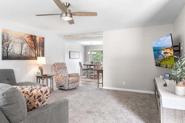 30 Highland Ave, Ripon, WI 54971 - carpeted living area featuring a ceiling fan, baseboards, and a chandelier