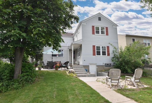 3330 S 47th St, Greenfield, WI 53219 - back of property with a lawn and a patio area