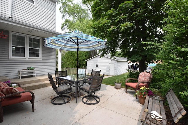 3330 S 47th St, Greenfield, WI 53219 - view of patio featuring outdoor dining space and an outbuilding