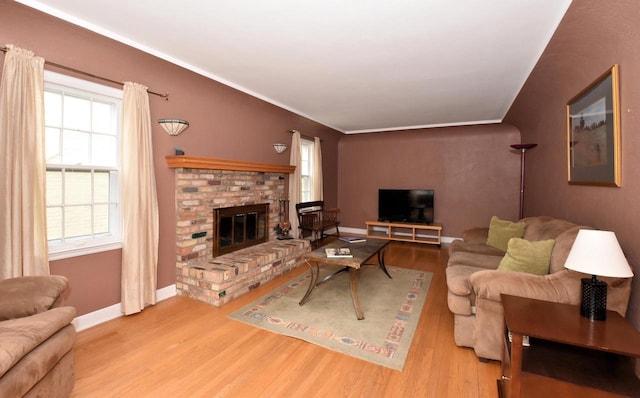 3330 S 47th St, Greenfield, WI 53219 - living area featuring wood finished floors, healthy amount of natural light, and a fireplace