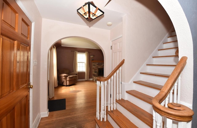 3330 S 47th St, Greenfield, WI 53219 - stairs with arched walkways and wood finished floors