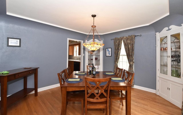 3330 S 47th St, Greenfield, WI 53219 - dining space featuring light wood-style floors and baseboards
