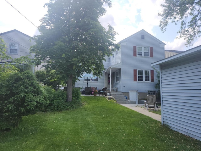 3330 S 47th St, Greenfield, WI 53219 - rear view of house featuring a lawn