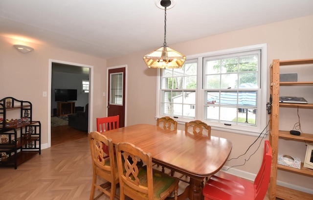 3330 S 47th St, Greenfield, WI 53219 - dining area with plenty of natural light and a chandelier