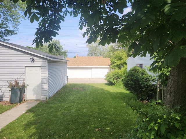 3330 S 47th St, Greenfield, WI 53219 - view of yard featuring a detached garage