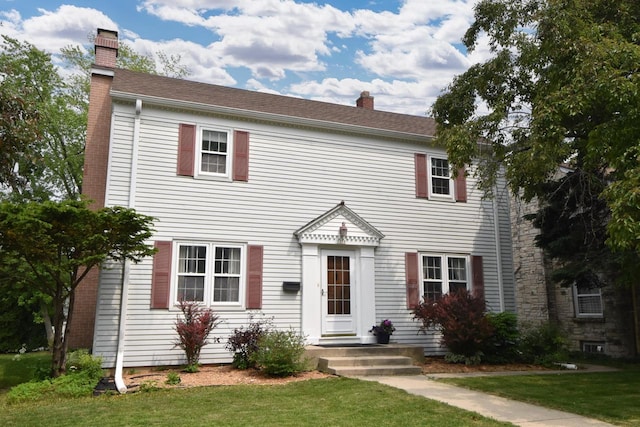 3330 S 47th St, Greenfield, WI 53219 - colonial inspired home with a chimney and a front lawn