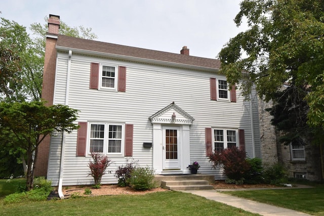 3330 S 47th St, Greenfield, WI 53219 - colonial inspired home with a chimney and a front lawn