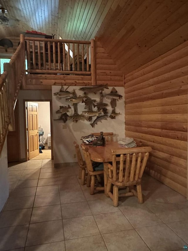 58875 Roy Anderson Rd, Mason, WI 54856 - dining area featuring wood ceiling, tile patterned flooring, high vaulted ceiling, and rustic walls