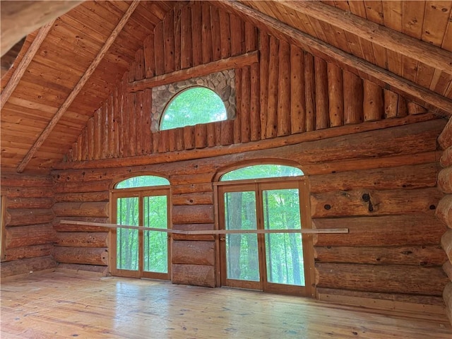 2949 27 1/4 St, Birchwood, WI 54817 - unfurnished living room featuring wood ceiling with exposed beams, high vaulted ceiling, plenty of natural light, hardwood / wood-style floors, and log walls