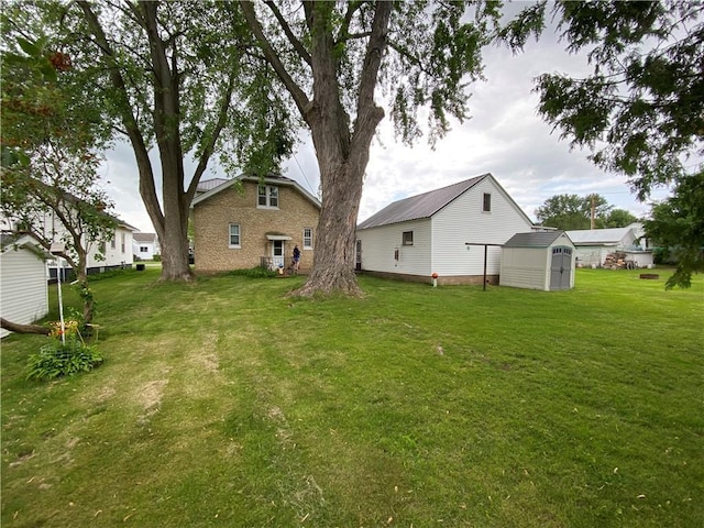 1114 Newman St, Bloomer, WI 54724 - view of green lawn with a storage shed