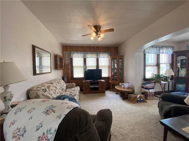 1114 Newman St, Bloomer, WI 54724 - living room with light colored carpet, a ceiling fan, and arched walkways