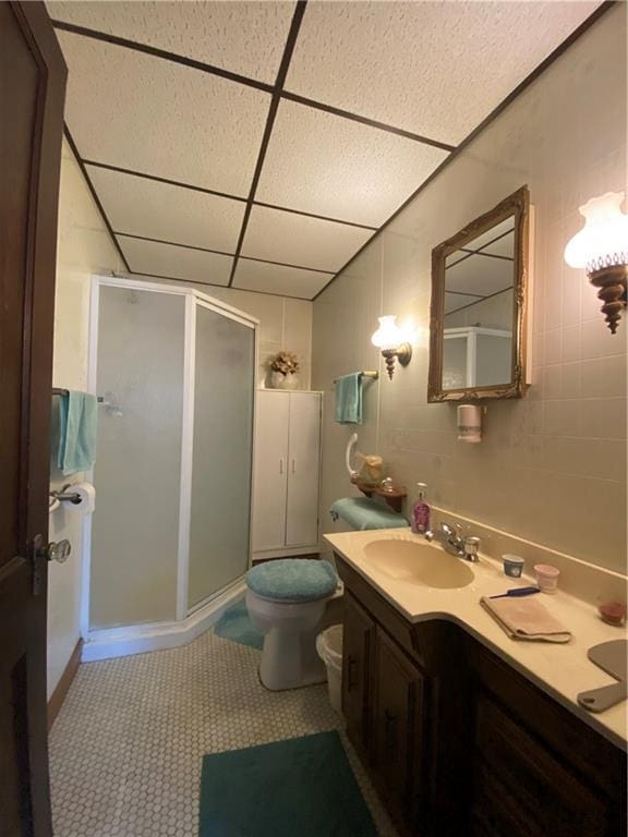 1114 Newman St, Bloomer, WI 54724 - bathroom featuring a paneled ceiling, a stall shower, and vanity