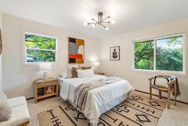 4951 W Joleno Ln, Brown Deer, WI 53223 - bedroom featuring a chandelier and light carpet