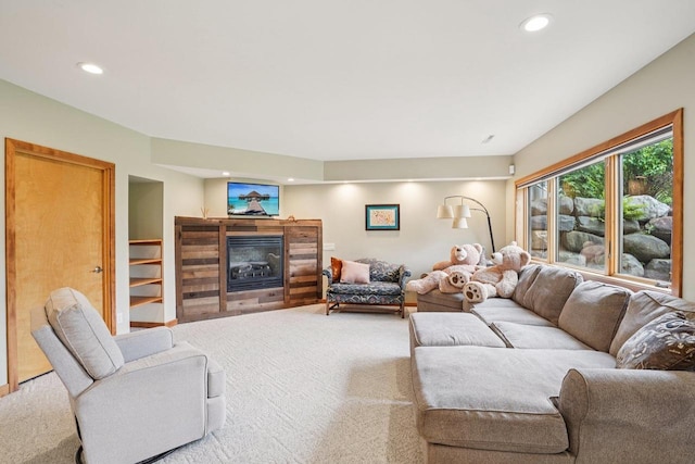 7965 Westhill Cir, Verona, WI 53593 - living area featuring a glass covered fireplace, carpet flooring, and recessed lighting