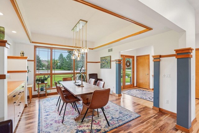7965 Westhill Cir, Verona, WI 53593 - dining area featuring a raised ceiling, healthy amount of natural light, wood finished floors, and recessed lighting
