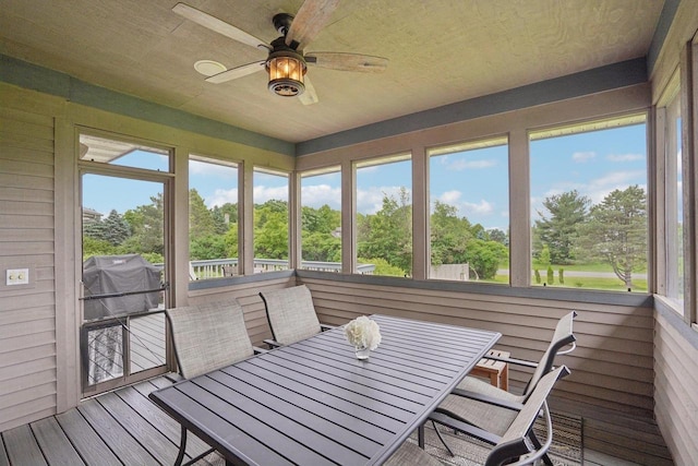 7965 Westhill Cir, Verona, WI 53593 - sunroom / solarium featuring ceiling fan, view of scattered trees, and outdoor dining space