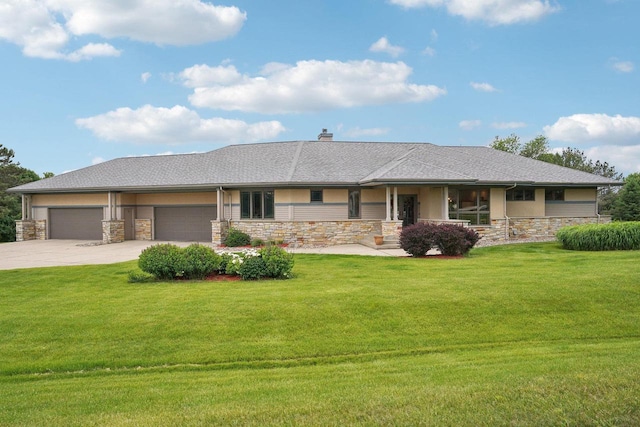 7965 Westhill Cir, Verona, WI 53593 - view of front of home with stone siding, a garage, a front lawn, and driveway