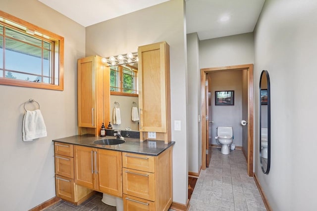 7965 Westhill Cir, Verona, WI 53593 - full bathroom featuring toilet, vanity, and baseboards