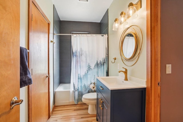 7965 Westhill Cir, Verona, WI 53593 - bathroom featuring toilet, vanity, wood finished floors, and shower / bath combination with curtain
