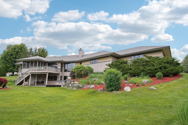 7965 Westhill Cir, Verona, WI 53593 - rear view of property featuring stairs, a deck, a chimney, a lawn, and a sunroom