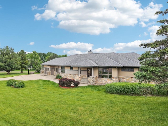 7965 Westhill Cir, Verona, WI 53593 - view of front facade featuring stone siding, a front yard, driveway, a chimney, and stucco siding