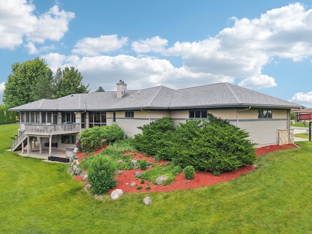 7965 Westhill Cir, Verona, WI 53593 - back of house featuring a chimney, stairs, a deck, a patio, and a lawn