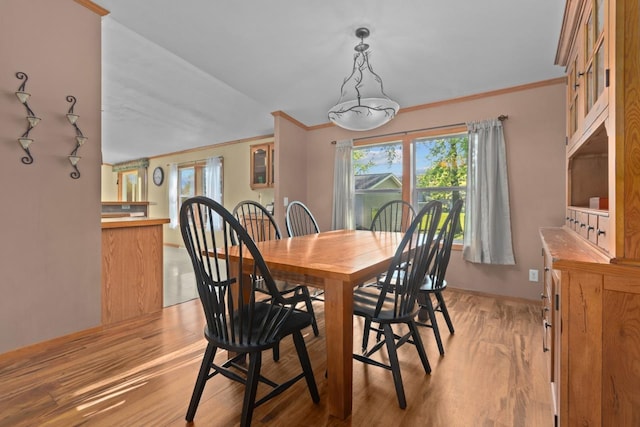 227 Cedar St, Ripon, WI 54971 - dining room featuring ornamental molding and light wood-type flooring
