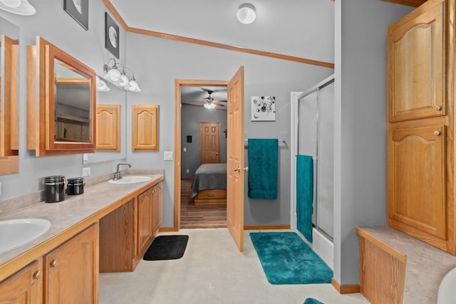 227 Cedar St, Ripon, WI 54971 - bathroom featuring a shower stall, double vanity, ensuite bath, and a ceiling fan