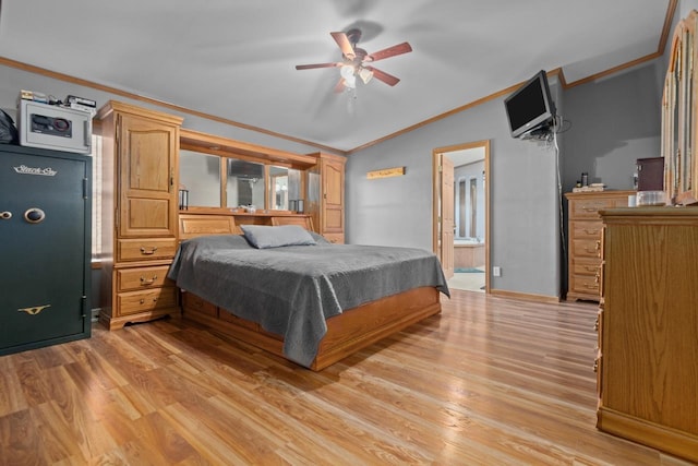 227 Cedar St, Ripon, WI 54971 - bedroom with vaulted ceiling, ornamental molding, light wood-style flooring, ensuite bath, and ceiling fan