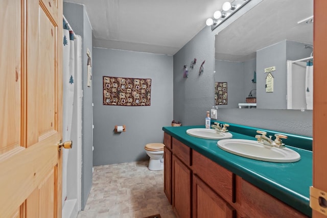 227 Cedar St, Ripon, WI 54971 - bathroom with double vanity, a shower, and toilet