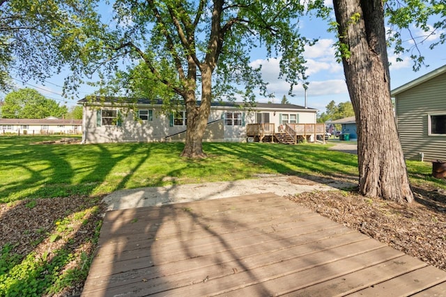 227 Cedar St, Ripon, WI 54971 - rear view of property featuring a deck and a lawn