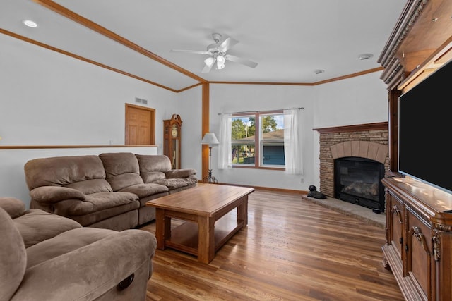 227 Cedar St, Ripon, WI 54971 - living area with ornamental molding, a ceiling fan, a stone fireplace, wood finished floors, and baseboards