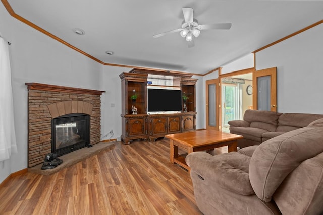 227 Cedar St, Ripon, WI 54971 - living room with light wood-style floors, ornamental molding, a ceiling fan, a fireplace, and vaulted ceiling