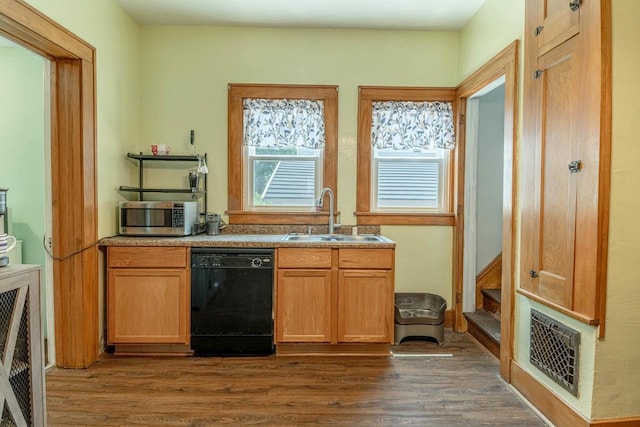 1600 15th Ave, Monroe, WI 53566 - kitchen featuring black dishwasher, stainless steel microwave, and dark wood-style flooring