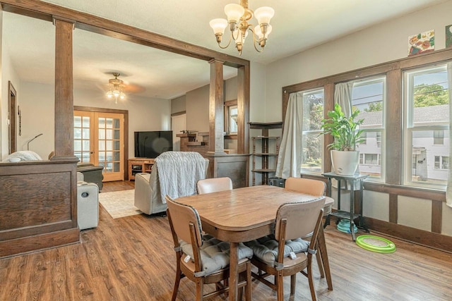 1600 15th Ave, Monroe, WI 53566 - dining space with healthy amount of natural light, ornate columns, and wood finished floors