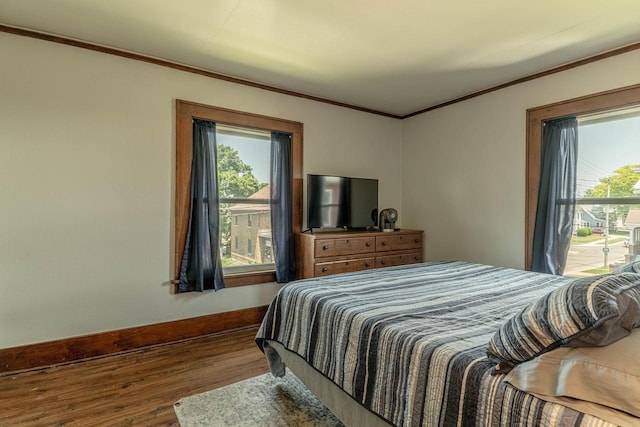1600 15th Ave, Monroe, WI 53566 - bedroom with multiple windows, wood finished floors, and ornamental molding