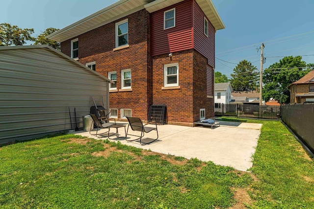 1600 15th Ave, Monroe, WI 53566 - rear view of property with a patio and brick siding