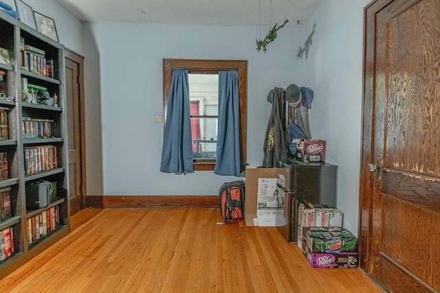 1600 15th Ave, Monroe, WI 53566 - miscellaneous room featuring wood finished floors and baseboards