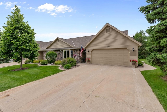1300 Hidden Fields Dr, West Bend, WI 53095 - single story home featuring an attached garage, concrete driveway, and a front yard
