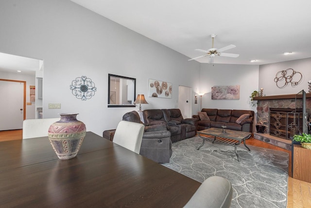 1300 Hidden Fields Dr, West Bend, WI 53095 - living area featuring wood finished floors, a ceiling fan, a fireplace, and recessed lighting