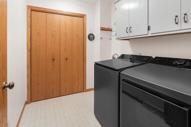 1300 Hidden Fields Dr, West Bend, WI 53095 - laundry room with washing machine and clothes dryer, light flooring, and cabinet space