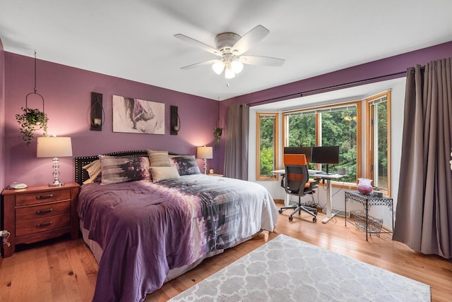 1300 Hidden Fields Dr, West Bend, WI 53095 - bedroom with wood finished floors, a desk, and a ceiling fan
