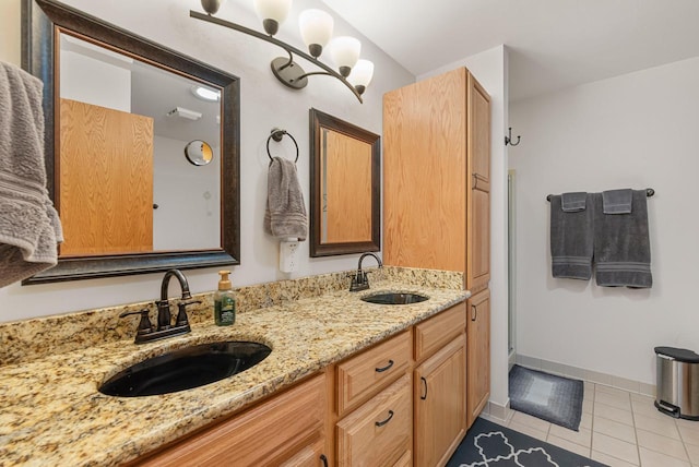 1300 Hidden Fields Dr, West Bend, WI 53095 - full bathroom with double vanity and tile patterned floors