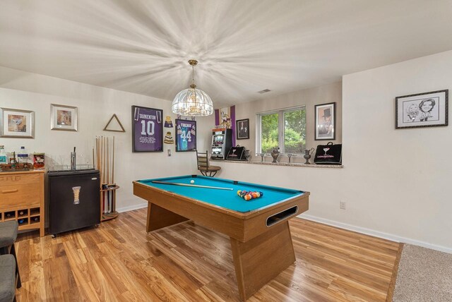 1300 Hidden Fields Dr, West Bend, WI 53095 - rec room with pool table, wood finished floors, and a chandelier