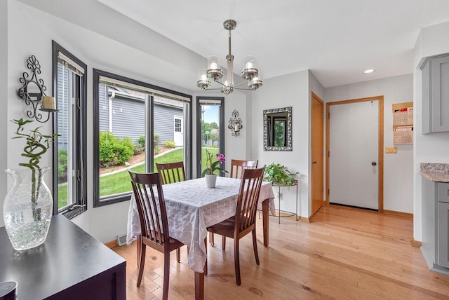 1300 Hidden Fields Dr, West Bend, WI 53095 - dining area with a chandelier, light wood-style floors, and recessed lighting